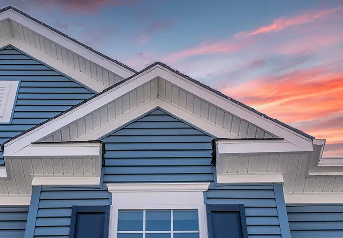 gorgeous view of residential home with blue siding an trim, plus white soffit and fascia - Clinton County, IL