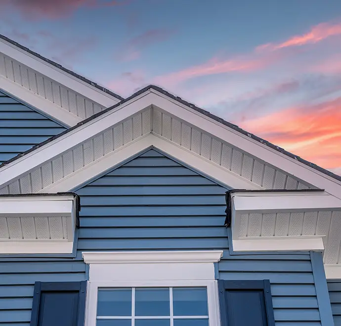 gorgeous view of residential home with blue siding an trim, plus white soffit and fascia - belleville, IL