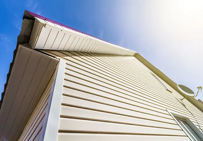 View from below of house siding, with soffit and fascia - Belleville, IL