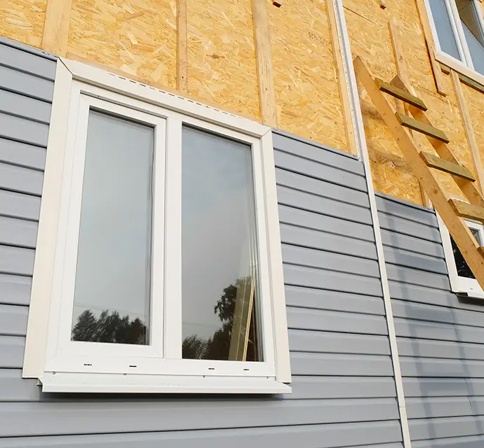New house construction vinyl siding installation - Highland, IL