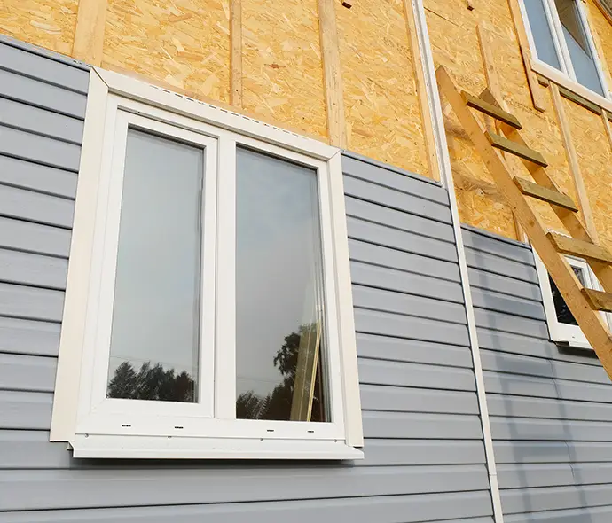 New house construction vinyl siding installation - Washington County, IL