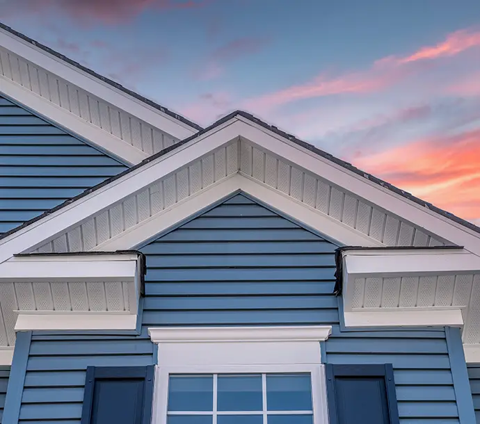 gorgeous view of residential home with blue siding an trim, plus white soffit and fascia - Breese, IL