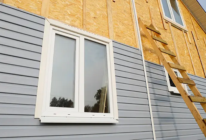 New house construction vinyl siding installation - Breese, IL